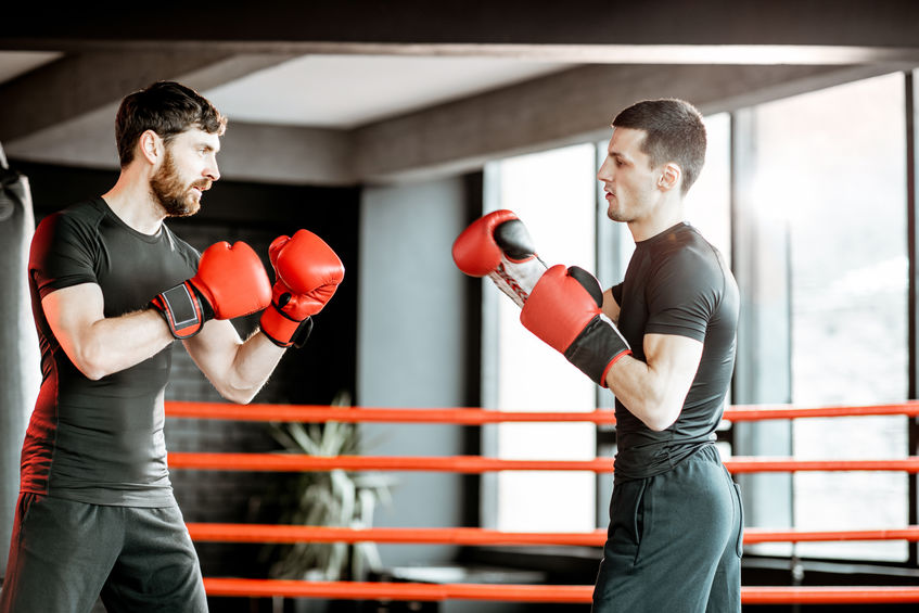 Two professional boxers fighting at the gym